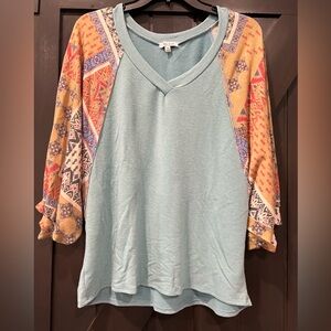 Very Soft/comfy shirt. (Main color shirt is more of a teal)